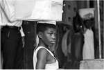 A Young Ghanian Woman Captured in a Balancing Act on the Streets of Accra by Ian Hovis